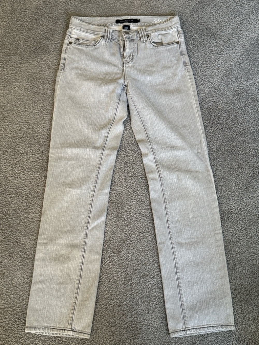 Calvin Klein Skinny Jeans in Light Gray. 5 Pocket, Embroidered Pockets, Size 4